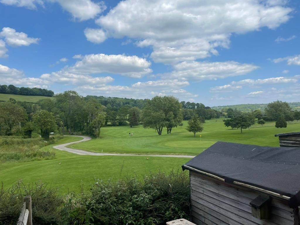 Lot: 70 - SEMI-DETACHED HOUSE FOR IMPROVEMENT - View from first floor over part of golf course